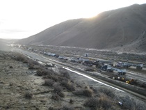 Multiple trucks lined up to haul away mud from State Route 58 in October, 2015.