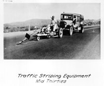 A black and white photo showing how highways were striped in the 1930s.