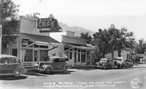 Cars line the side of the street in this black and white picture of Main Street in Independence in 1936.