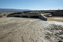 A series of box culverts are nearly full of mud following historic flooding in September, 2022.