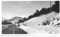 An undated black and white image of a snowblower removing snow from U.S. 395 near Bridgeport.
