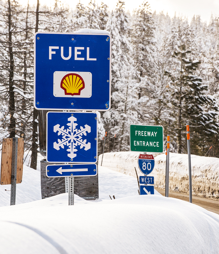 Photo depicts a sign on the side of interstate 80 showing "fuel" with a shell gas station logo below.