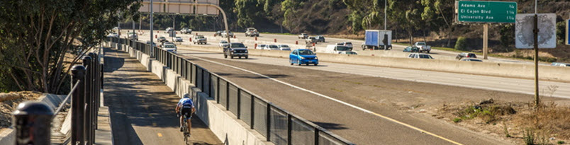 image of caltrans freeway next to a bike path
