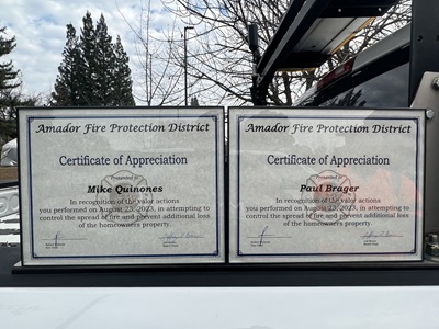 Paul Brager and Mike Quinones from the Caltrans District 10 Pine Grove Maintenance Station received these certificates from the Amador Fire Department in Jackson on Dec. 6
